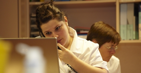 Young female nurse talking on the phone