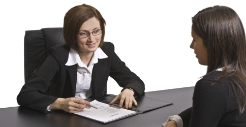 Young woman talking with recruiter in a job interview