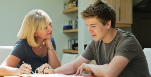 Speech therapist helping teenager