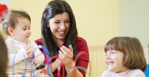 Early childhood educator playing with children